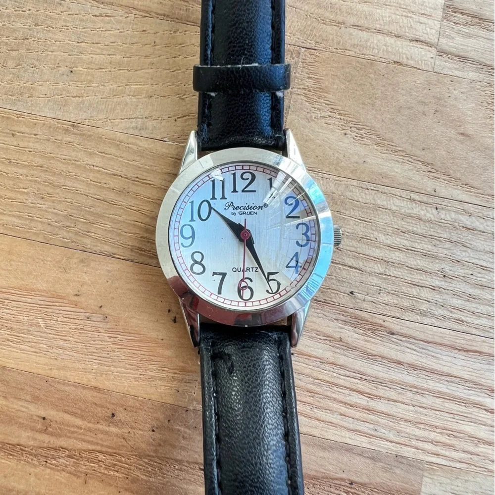 Precision by Gruen ladies silver tone black leather dress watch NEW BATTERY